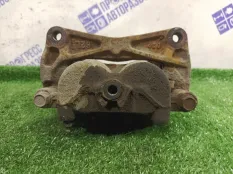 Суппорт тормозной передний левый Subaru Impreza