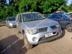 Брызговик Mitsubishi L200 2006 MN117445 KB4T, передний левый
