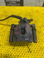 Суппорт тормозной задний левый SKODA OCTAVIA A7