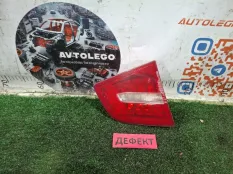 Фонарь в крышку багажника левый Audi A6