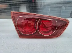 Фонарь в крышку багажника левый Mitsubishi Lancer