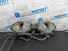 Суппорт тормозной передний Volkswagen Passat B6