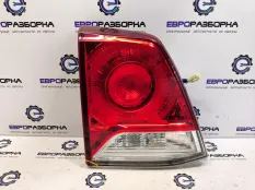 Фонарь крышки багажника левый Toyota Land Cruiser