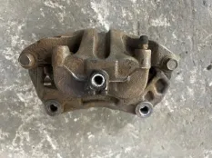 Суппорт передний левый Nissan Navara (D40) 2004-2015 2007 41011EB30A 2.5 D YD25DDTI
