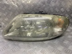Фара левая Chrysler Voyager IV (2000-2007) 04857711AB