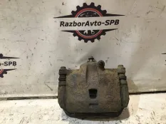 Суппорт передний левый Nissan Almera Classic