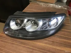 Фара галоген Hyundai Santa Fe 2 2006 921012B010, левая