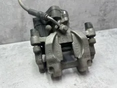 Суппорт тормозной Volkswagen Passat