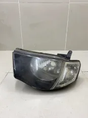 Фара левая Mitsubishi L200 KB