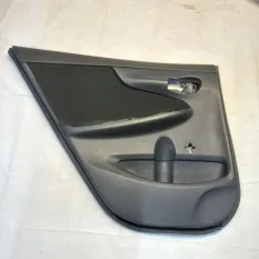 Обшивка двери задняя левая Toyota Corolla E150