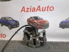 Суппорт тормозной задний левый Toyota Corolla E210